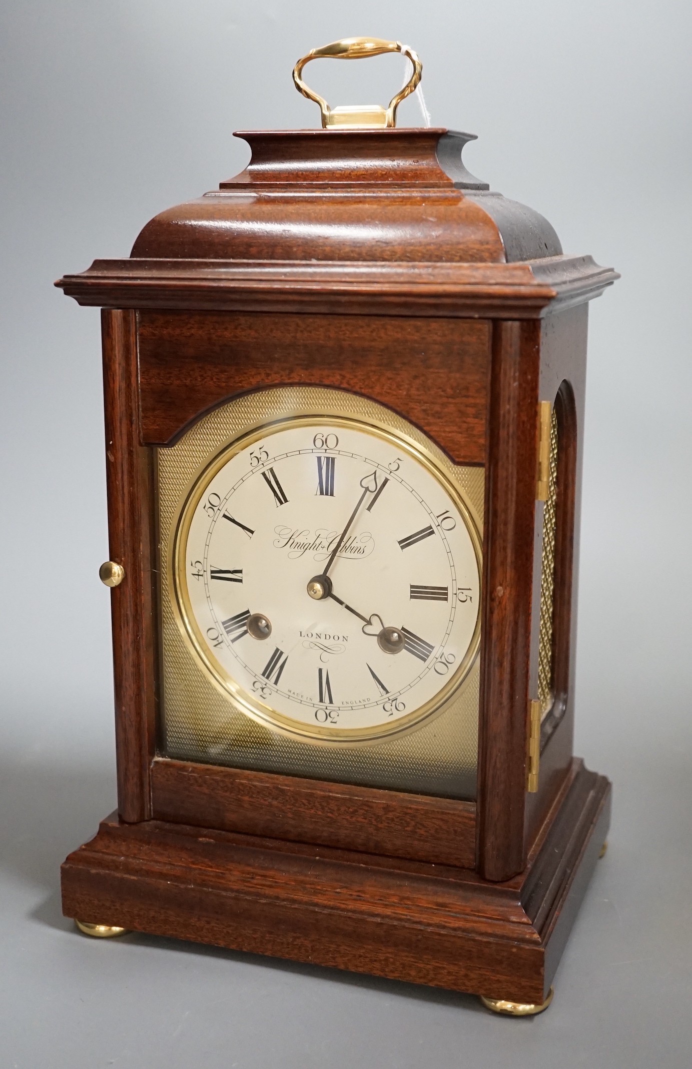 Knight and Gibbins. A reproduction mantel clock, 30c high